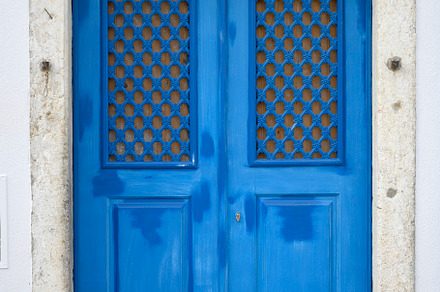 Front view of old blue wooden door with frosted glass window, an Architecture Photo by RF Images