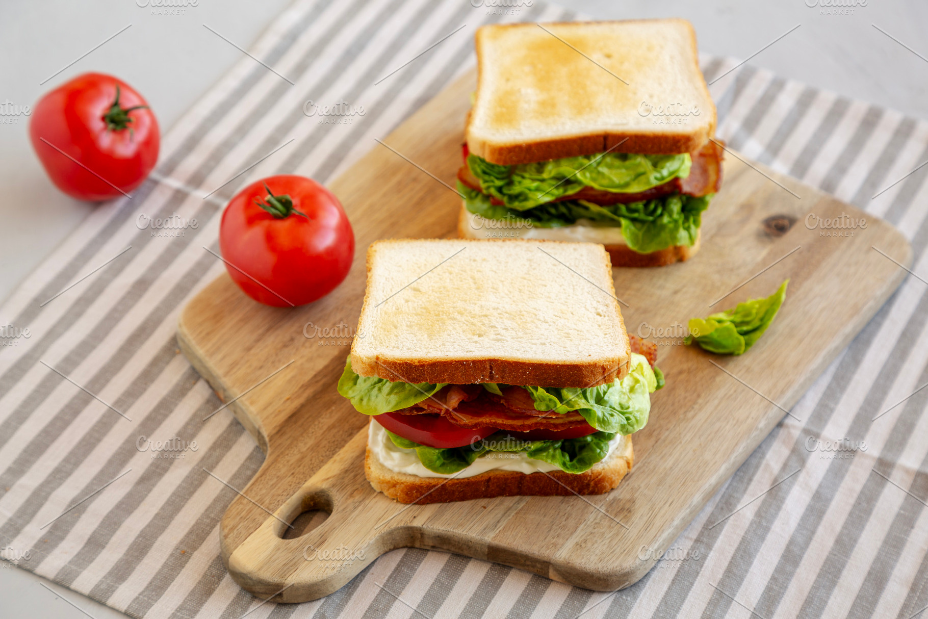 Homemade BLT (Bacon Lettuce Tomato) Sandwich with Mayo, side vie, a Food & Drink Photo by LiudmylaChuhunova