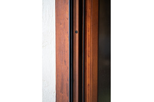 Wooden door frame with intricate, an Architecture Photo by volodymyrshtun13795