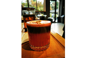 Red Bumble coffee mocktail in glass, a Food & Drink Photo by sceptical cactus