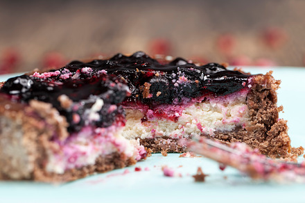 round tartlet with strawberries and blueberries in butter cream, a Food & Drink Photo by MyPhotos