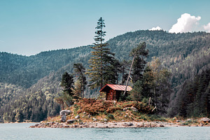Lake cabin containing lake, cabin, and nature