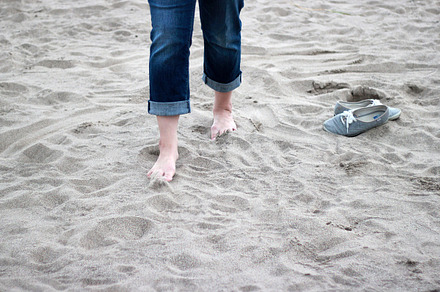 Walking on sand with bare feet