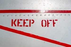 Keep Off warning sign on the fuselage of an old aircraft, a Transportation Photo by GoodGoods