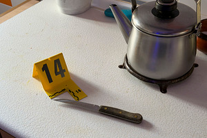 Knife with evidence marker at a crime scene