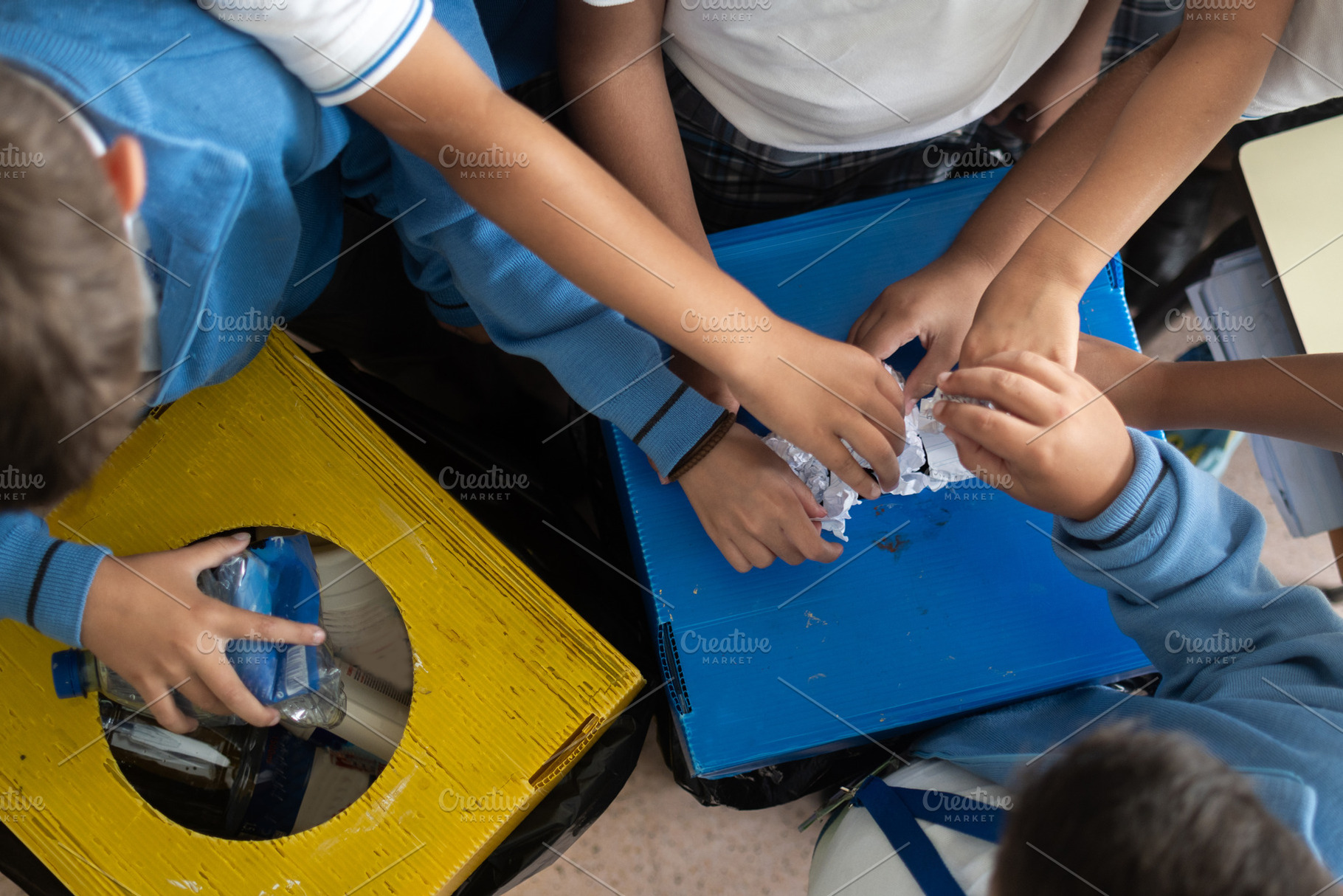 Elementary School Students Learning to Recycle Plastic Bottles, a Person Photo by etorres69