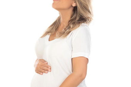 Young beautiful blonde woman pregnant expecting baby over isolat, a Person Photo by José Manuel Gelpi