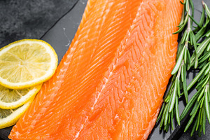 Fresh raw salmon fillet seafood ingredient with herbs and citrus, a Food & Drink Photo by composter-box@mail.ru