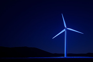 Single wind turbine illuminated in, a Nature Photo by MistyDay