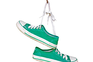 Old sneakers hanging isolated, a Sports & Recreation Photo by BOOCYS