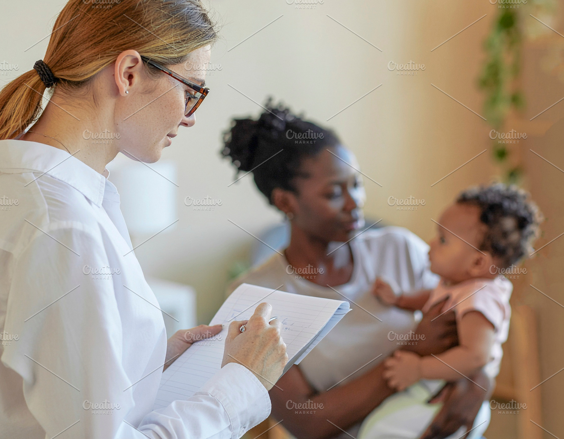 Social worker meeting with parent and infant, a Photo by DanFLCreativo