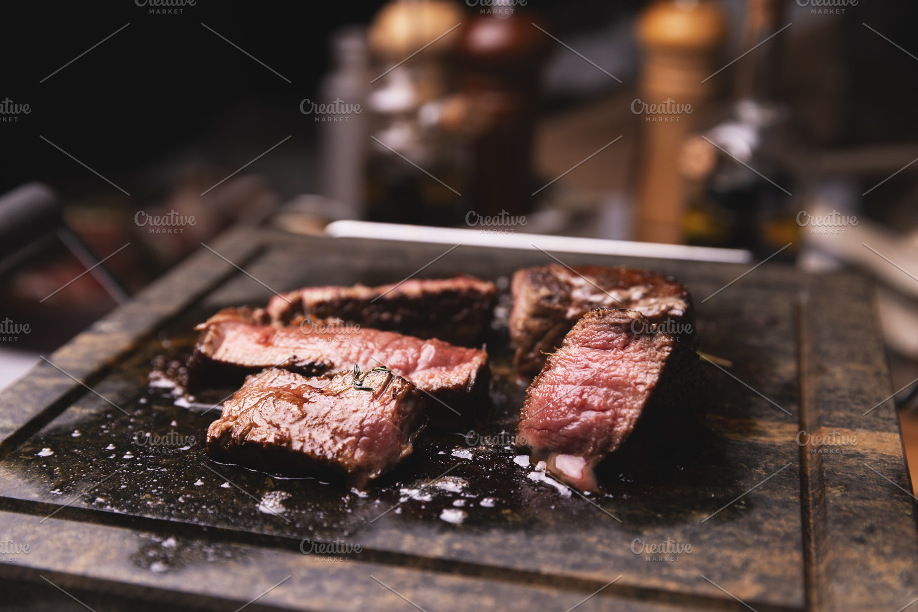 Sizzling medium rare steak, a Photo by Grafvision photography