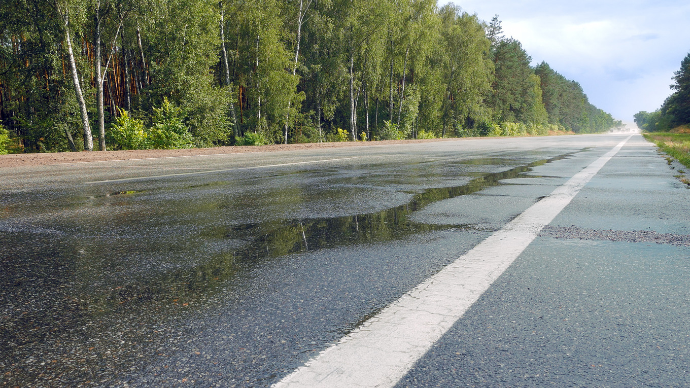 Wet road highway with mist splash, a Photo by HighRes Pictures