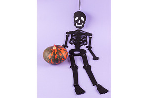 Black halloween skeleton with orange, a Holiday Photo by Lifemorning