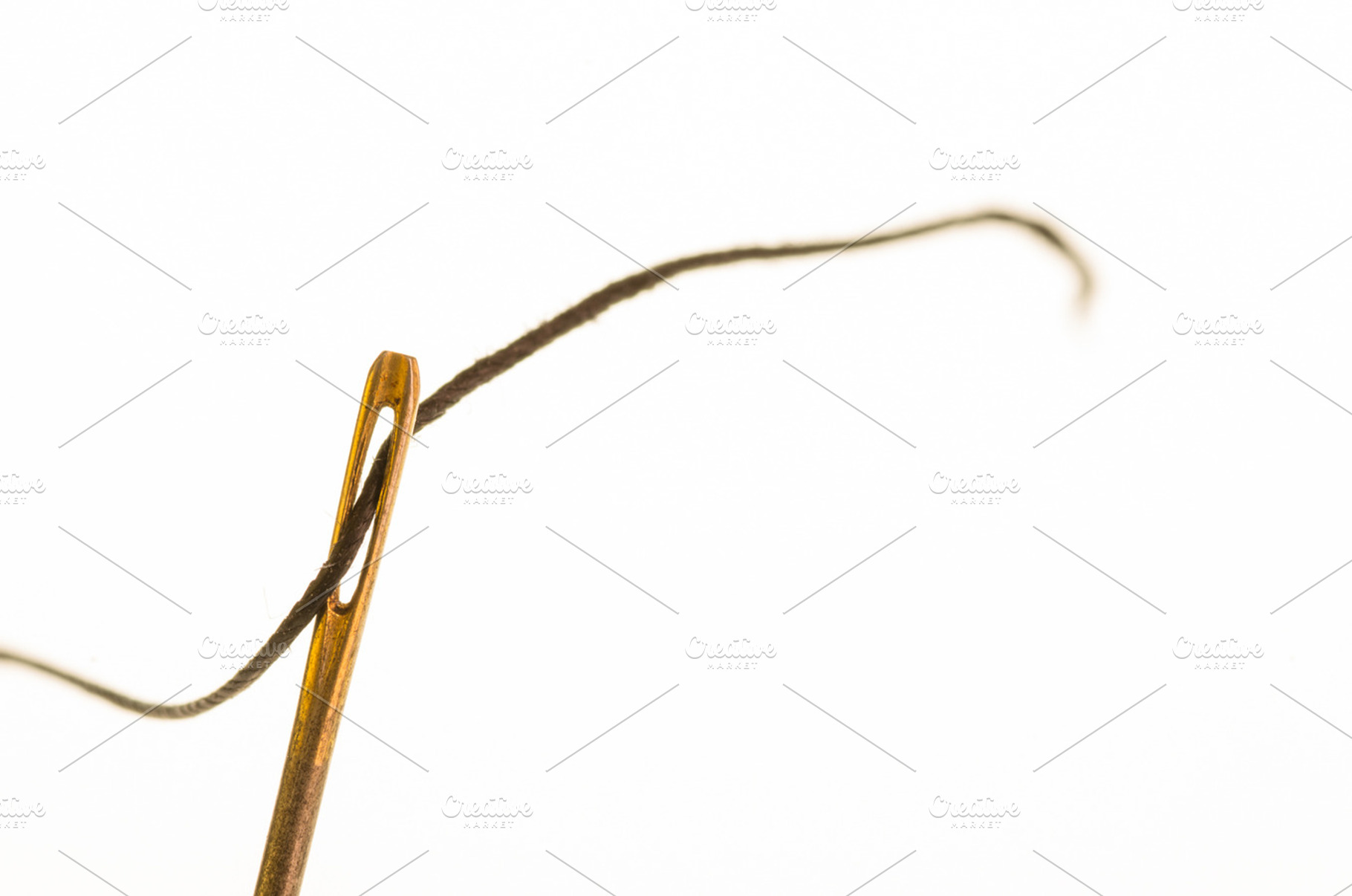 Needle threaded with sewing thread