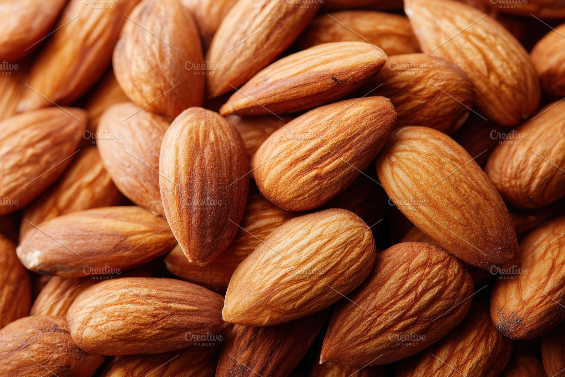 Background of roasted almonds nuts, a Food & Drink Photo by AlyaAnd