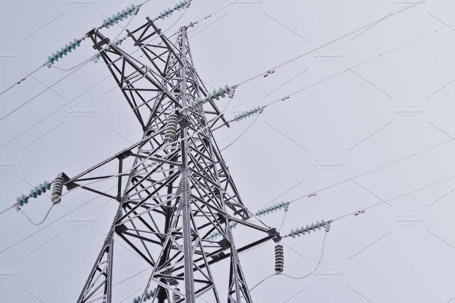 The frozen tower of a electric line featuring excellent, art, and reflection, an Industrial Photo by Pro.Motion
