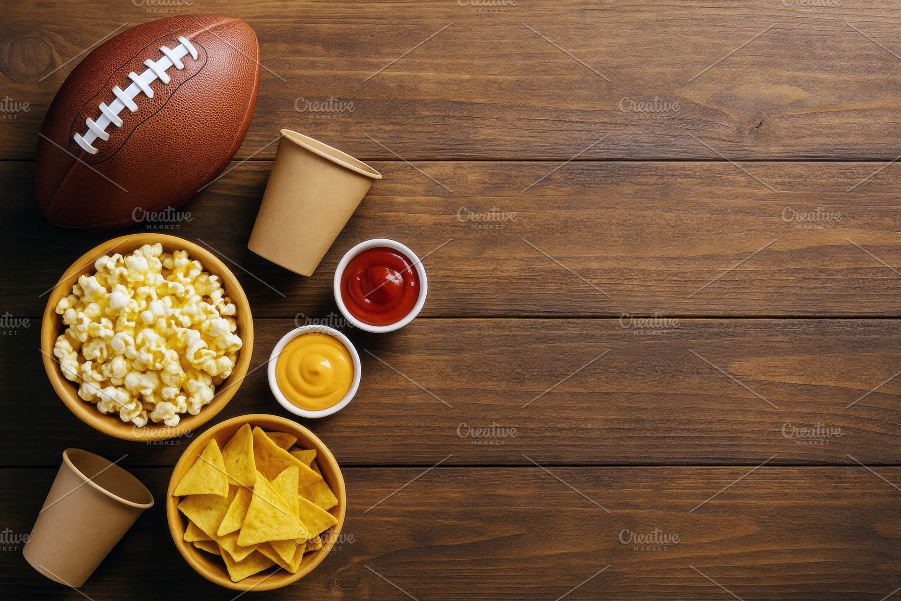 American football on wooden table wi, a Photo by Dvoevnore photos