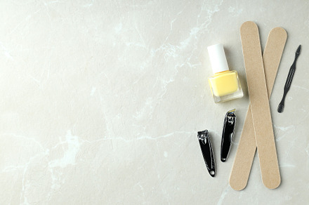 Concept of nail care with manicure accessories on light textured, a Beauty & Fashion Photo by AtlasStudio PRO