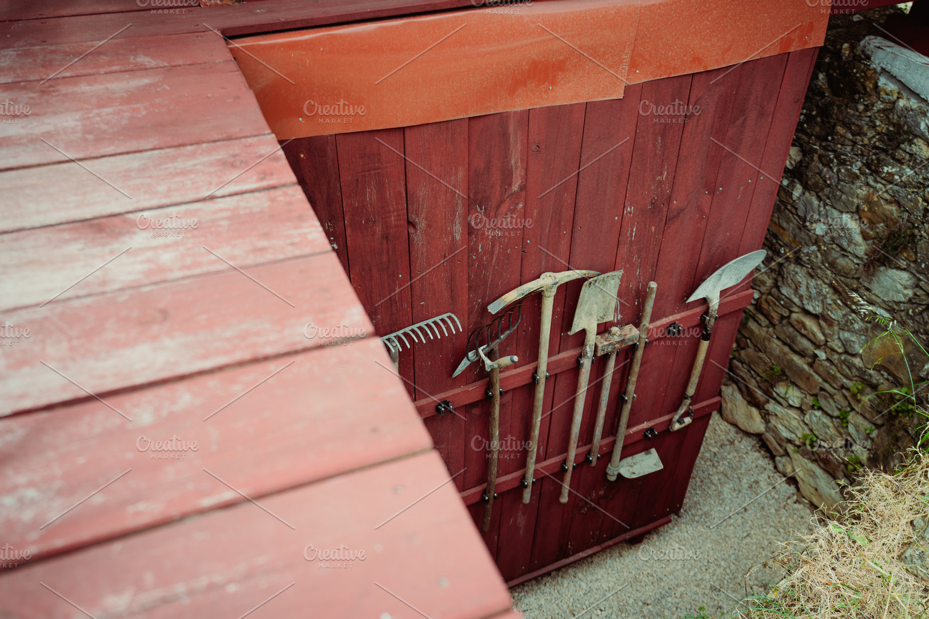 Red Wall With Garden Tools, an Industrial Photo by SkyNext