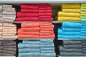 Bathing towels on shelf in shop, a Beauty & Fashion Photo by BOOCYS