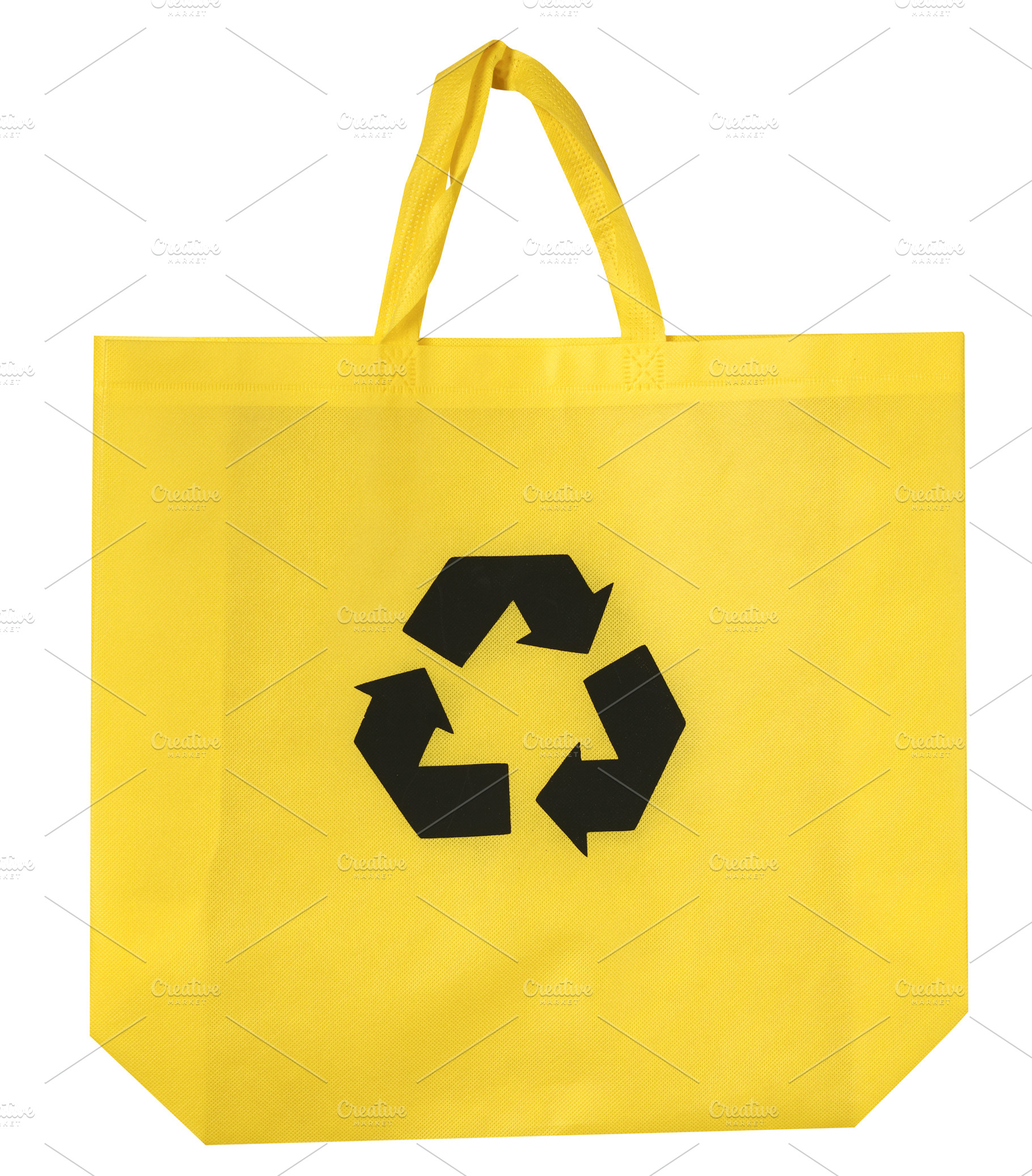 Yellow reusable shopper bag with black recycling symbol in the c, an Abstract Photo by ndanko