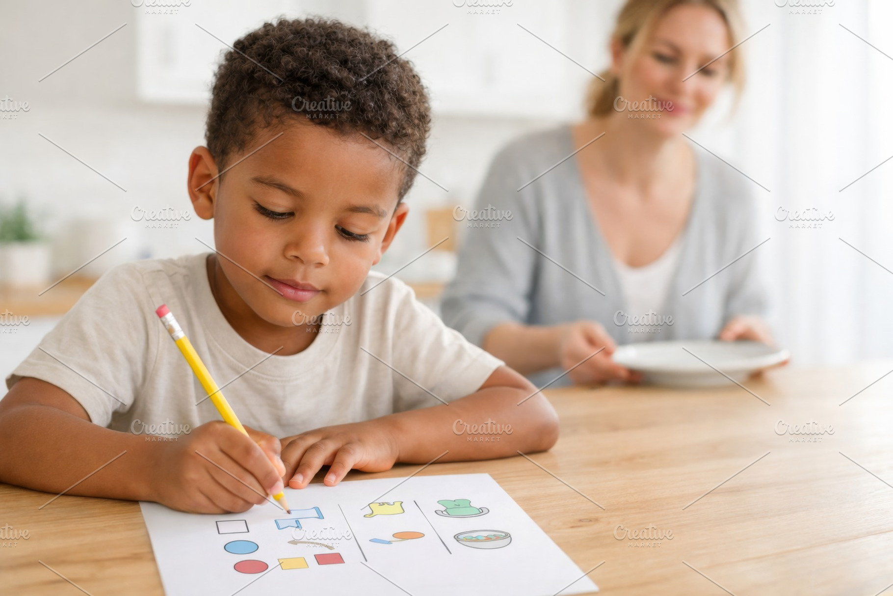 Young boy focused on educational cog, a Photo by Dvoevnore photos