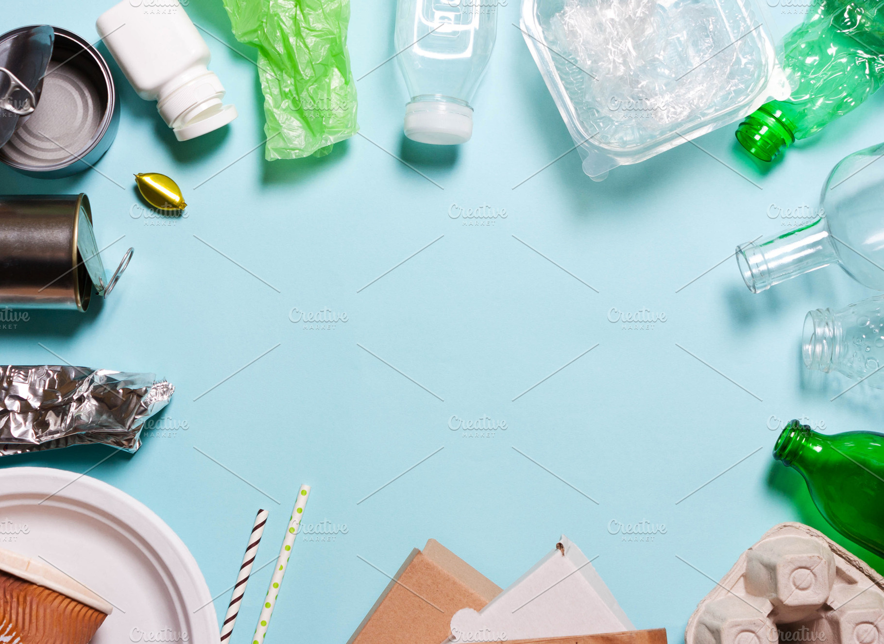 Household waste on a blue background containing waste, environment, and, an Industrial Photo by KulT design