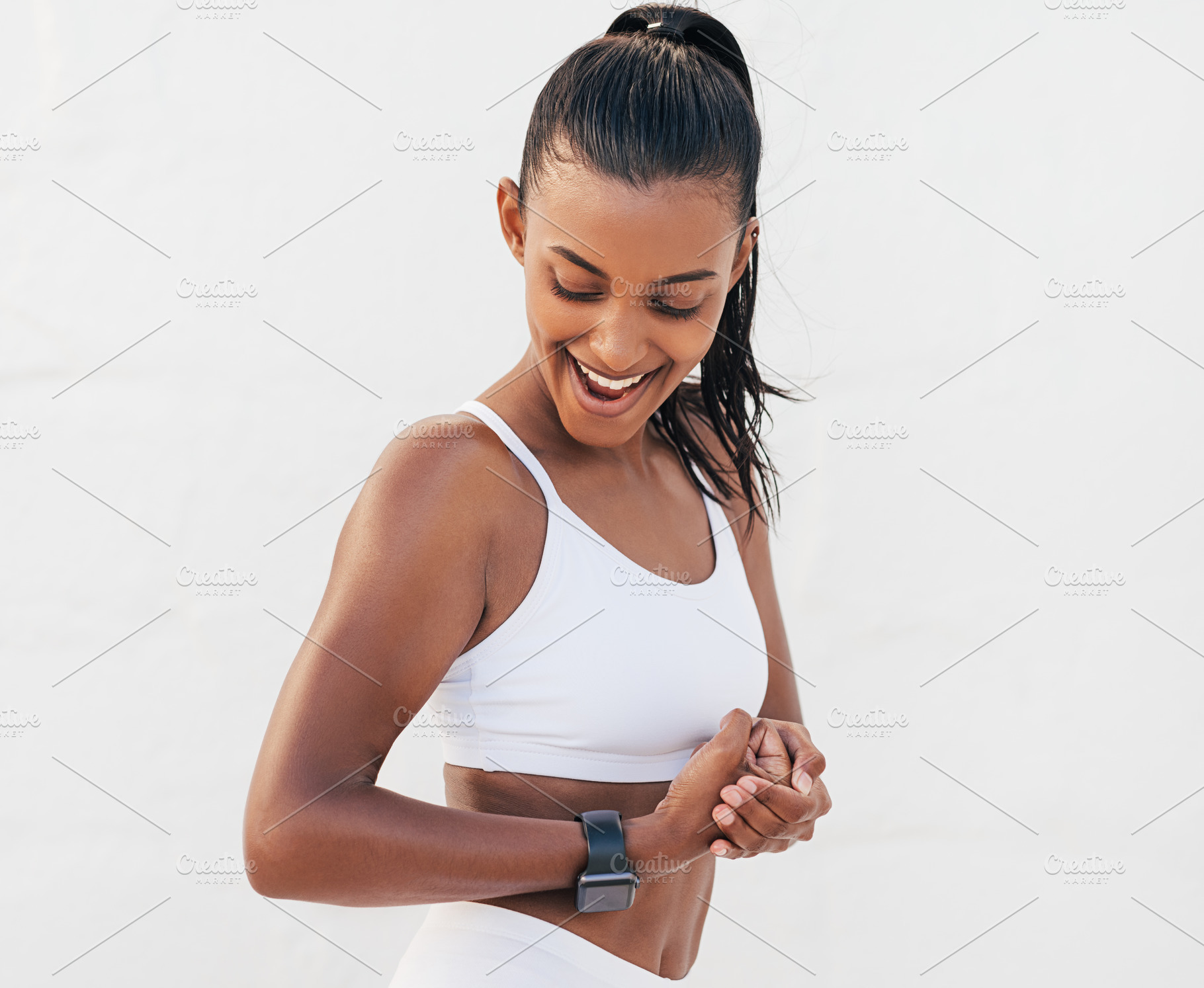 Smiling female showing her bicep, a Sports & Recreation Photo by Artem Varnitsin