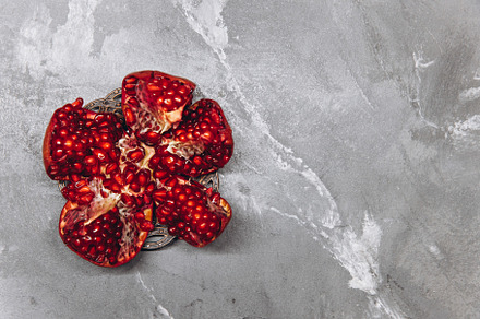 Fresh, cut pomegranate fruit, a Food & Drink Photo by Cherkas Photography