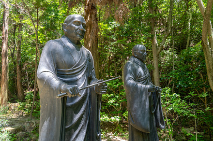 Bronze monk statues at Mitaki-Dera temple in Hiroshima, Japan