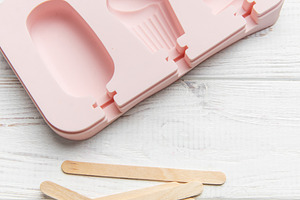 Pink silicone ice pop mold making summer treats, a Food & Drink Photo by Olena Rudo