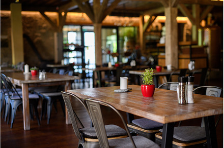 Modern restaurant with wooden tables, an Architecture Photo by HalfPoint