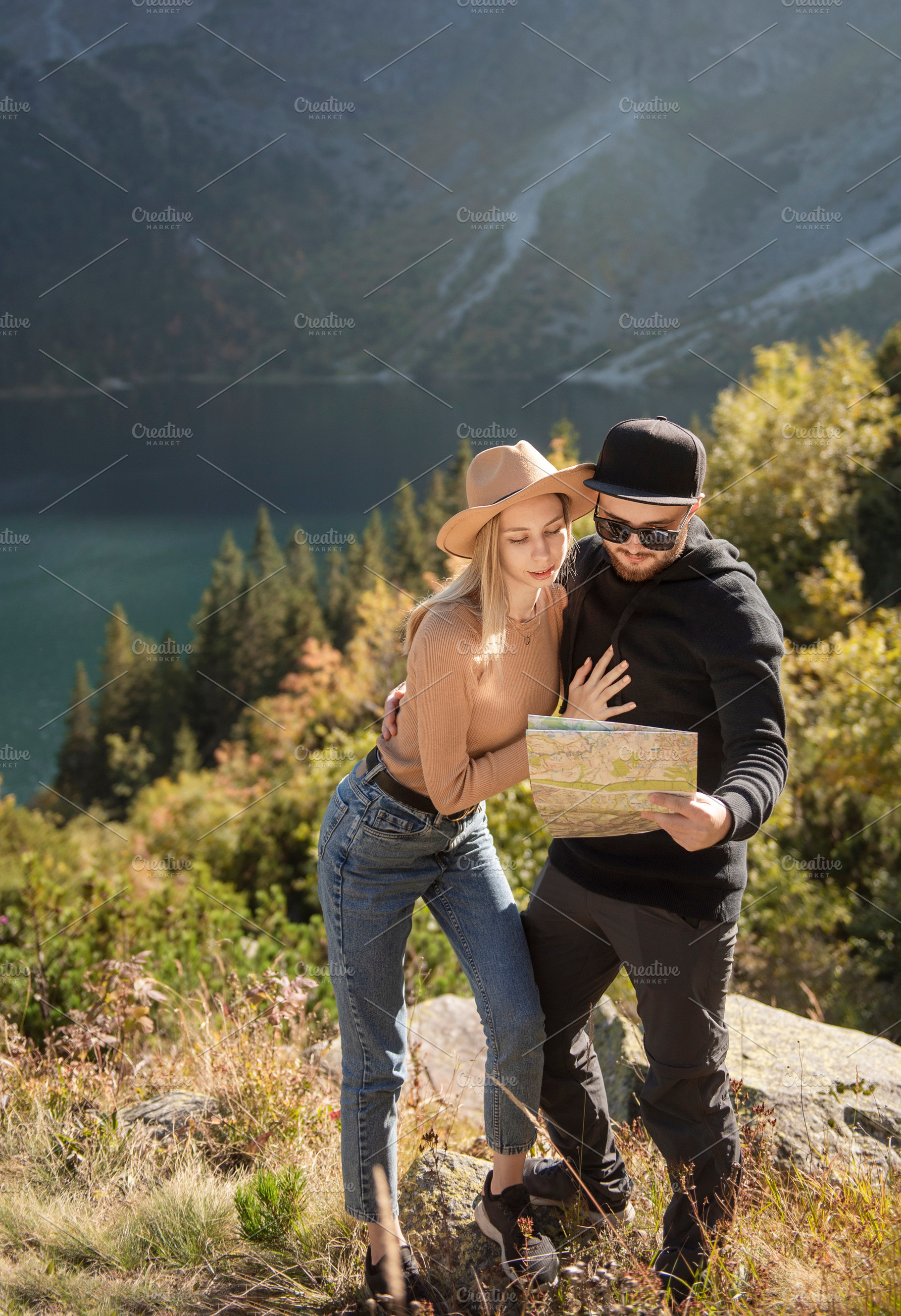 Young tourist couple, man and woman, on hiking path in mountains, a Sports & Recreation Photo by Olena Rudo