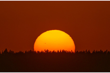 Experience a Majestic Sunset Over a, a Nature Photo by Lukas Jonaitis SHOP