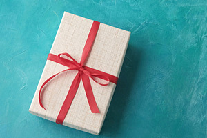 Birthday surprise party present wrapped gift box, a Background Photo by Photo Drive Studio