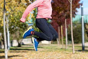 Senior man jumping high outdoors, showing energy and joy, a Sports & Recreation Photo by RF Images