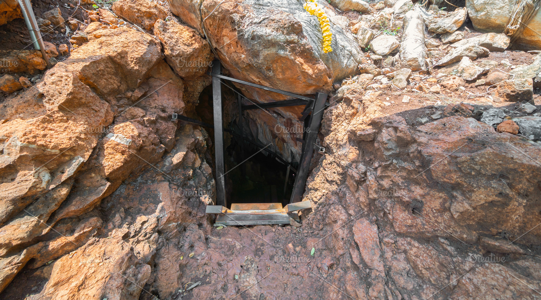 Natural stalactite and stalagmite rock stone cliff hang from cav, a Background Photo by Tampatra