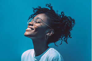 African American woman with a bright, a Person Photo by ZinetroN