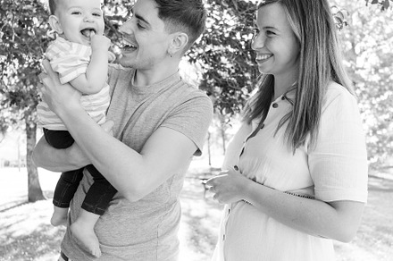 Portrait of a young family with their nine month old baby