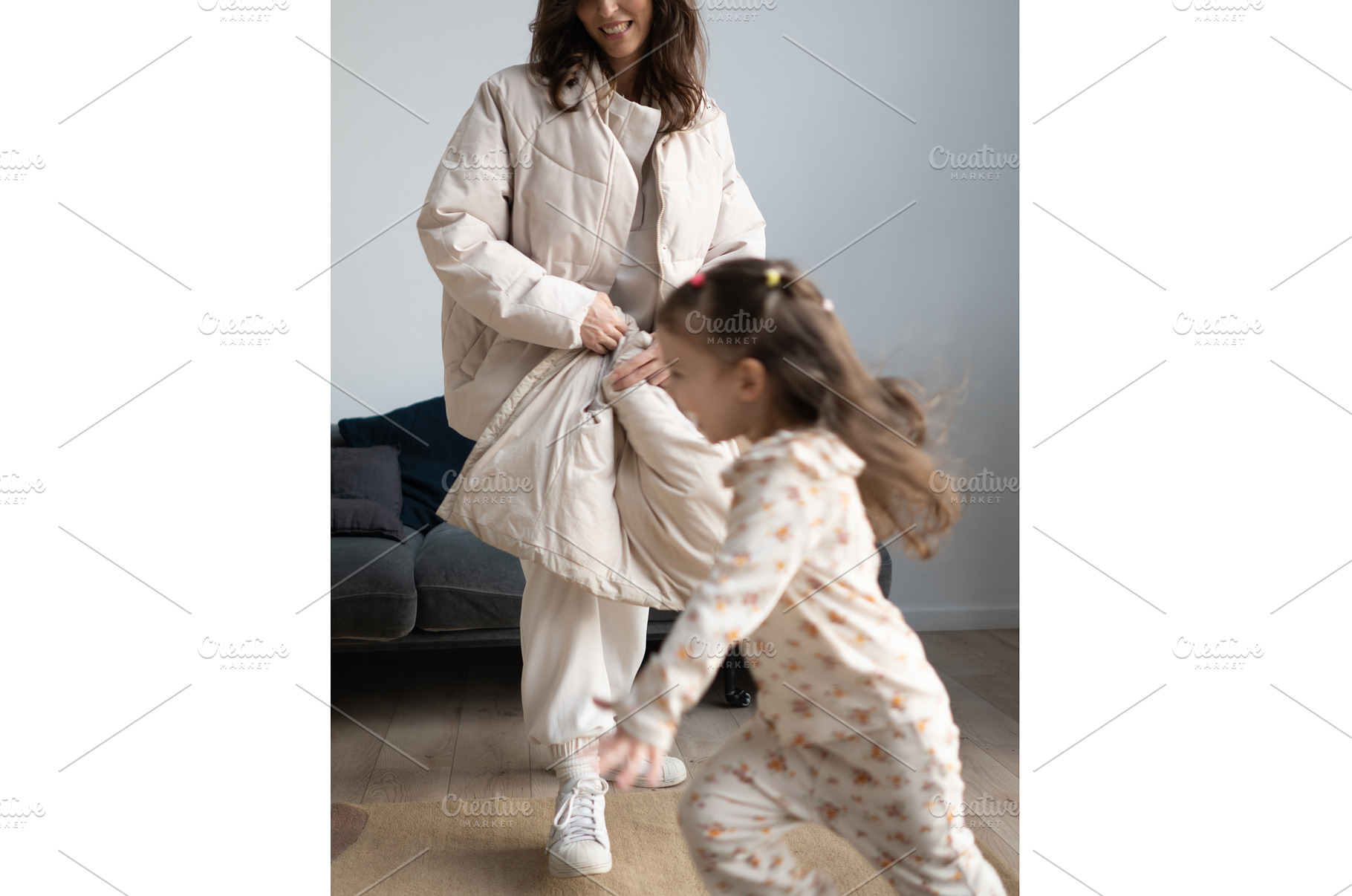 Girl runs across room as mother, a Person Photo by undrey