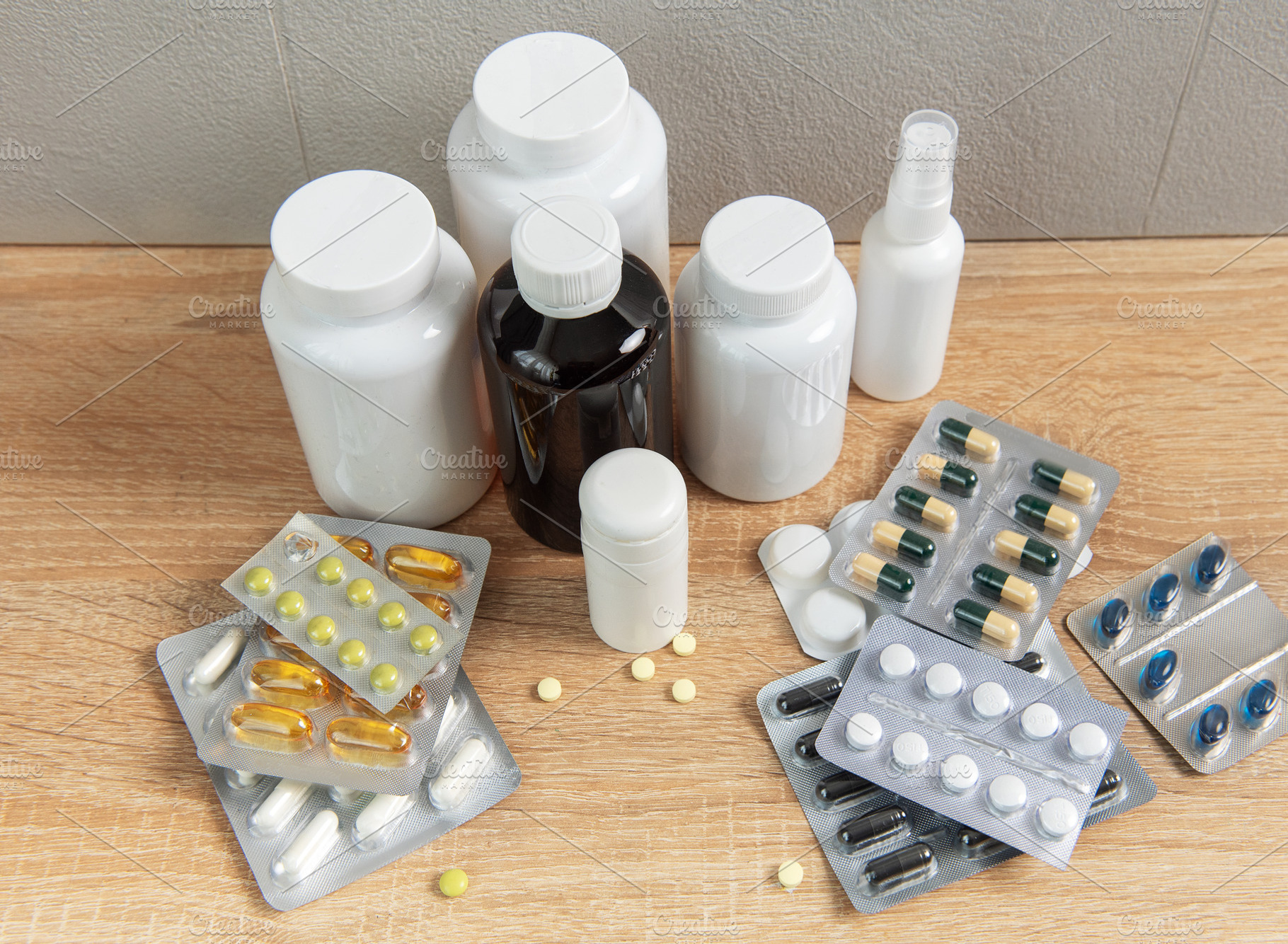 Medicine bottles and blister packs with various pills and capsul, a Health & Medical Photo by Olena Rudo