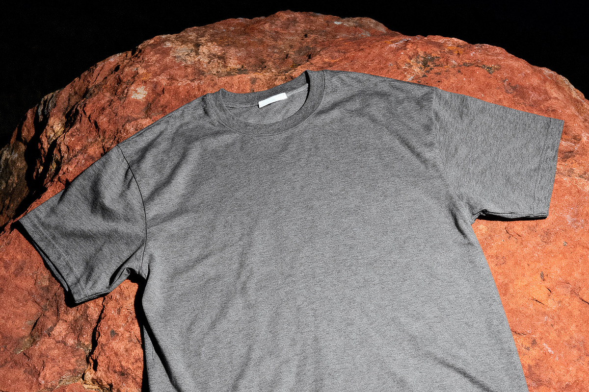 Outdoor T-Shirt Mockup on Stone, a Shirt Mockup by Design Squad (Photo 2 of 4)