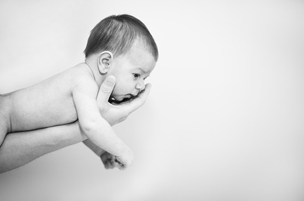 A newborn on his fathers hand against white, a Person Photo by rubenchase