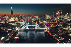 London by night showing Tower Bridge, an Architecture Photo by Goinyk