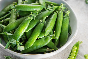Fresh green peas pods in white bowl, a Food & Drink Photo by Olena Rudo