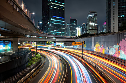 Bright light trails from vehicles we, a Photo by Tanuart