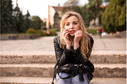 Woman is talking on the phone while, a Person Photo by oksix