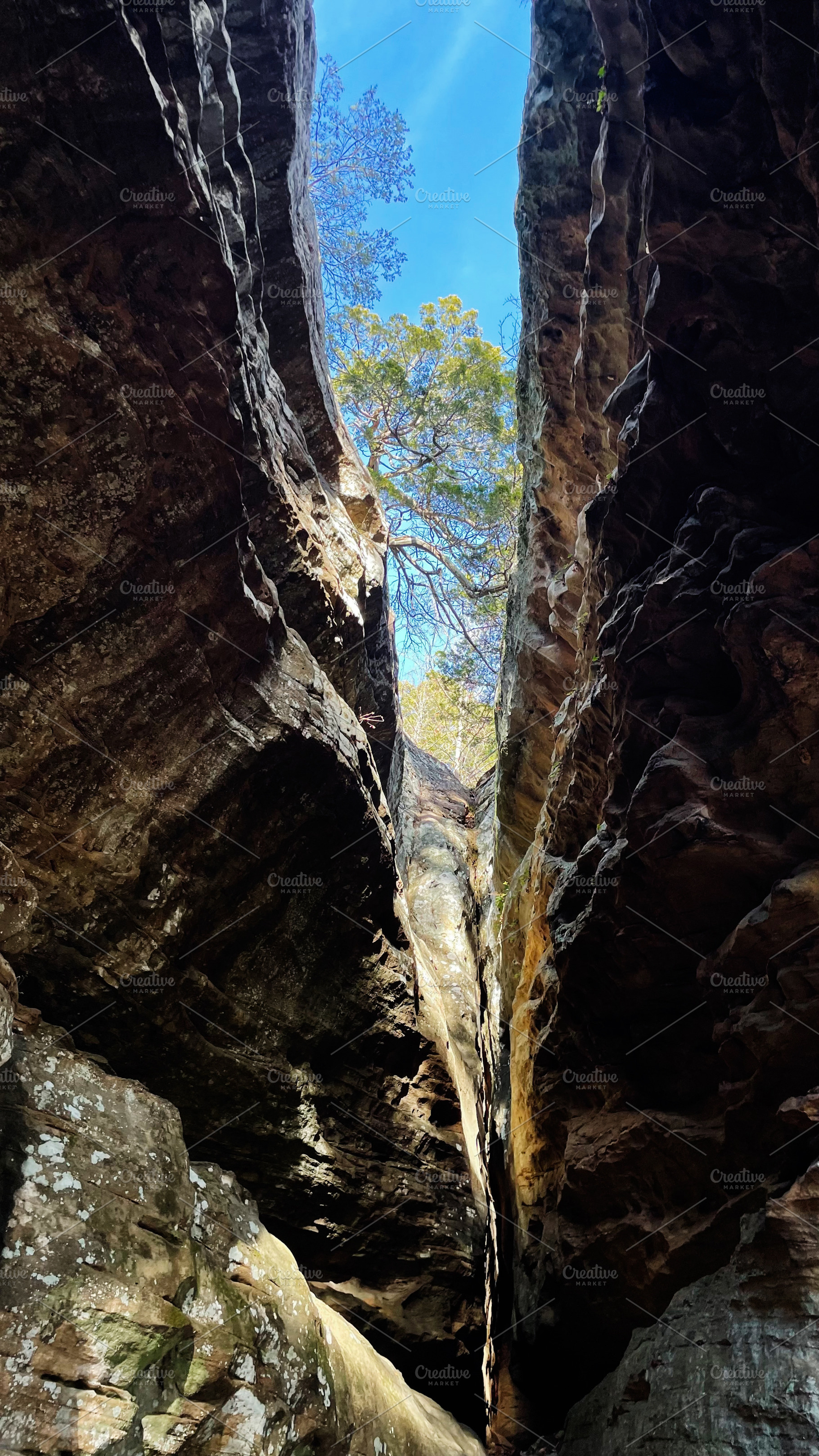 Bright blue sky peeks through narrow canyon walls at Garden of the Gods, Colora, a Nature Photo by AS photostudio