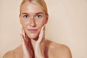 Female with freckled skin touching, a Beauty & Fashion Photo by Artem Varnitsin